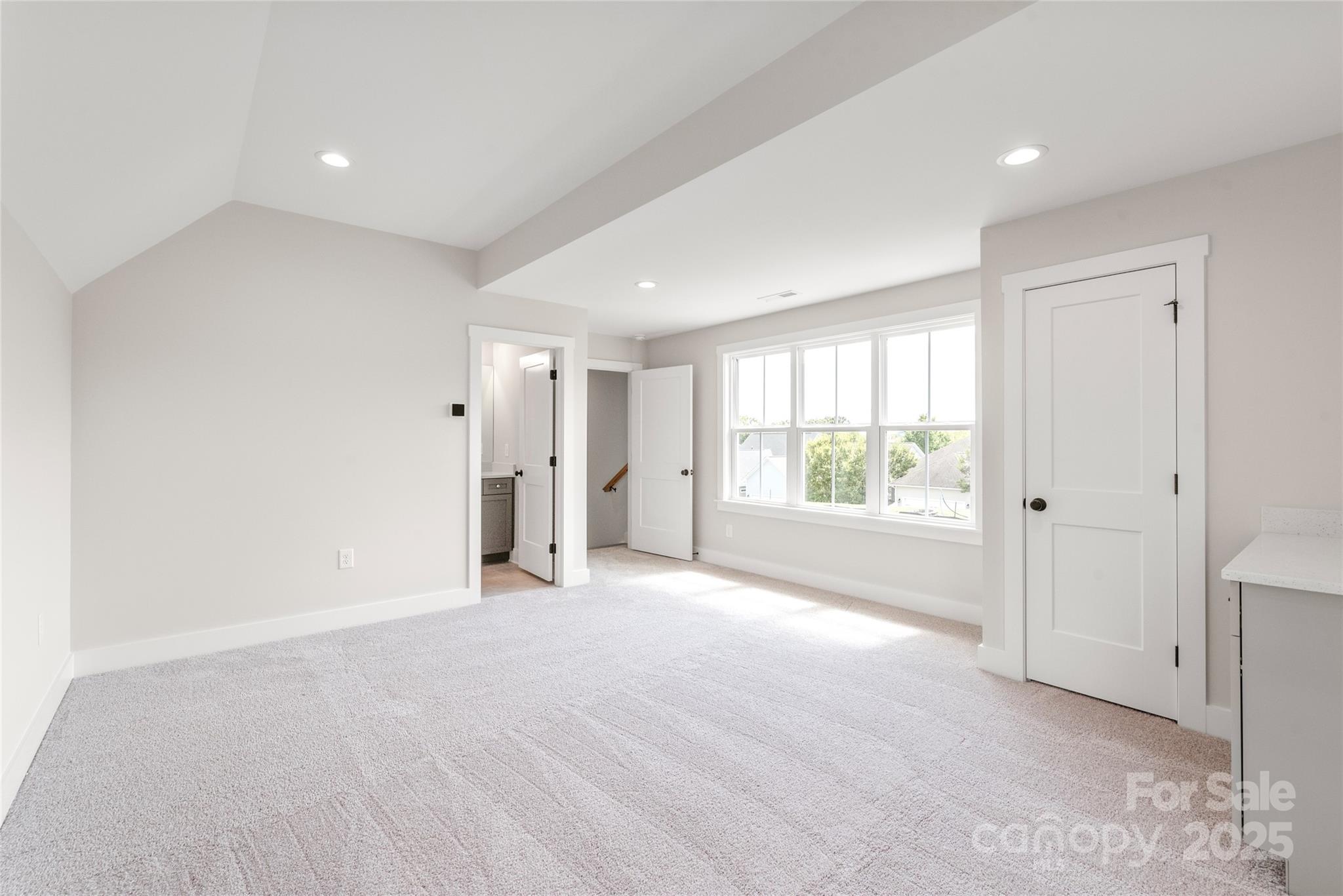 19028 Newburg Hill Road, Unit 22 Davidson, NC 28036 - Photo 39 of 44 a view of an empty room with a window