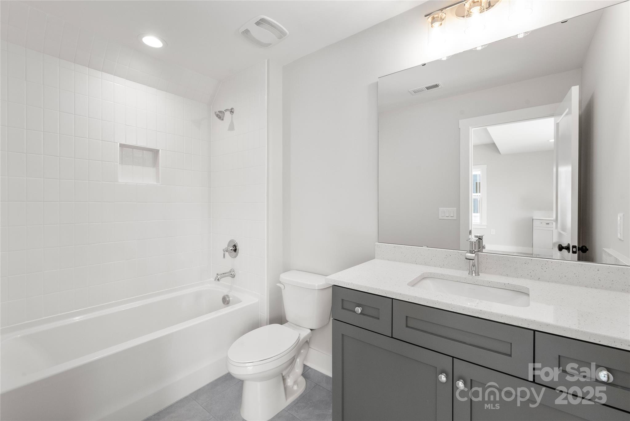 19028 Newburg Hill Road, Unit 22 Davidson, NC 28036 - Photo 40 of 44 a bathroom with a sink a toilet and a mirror