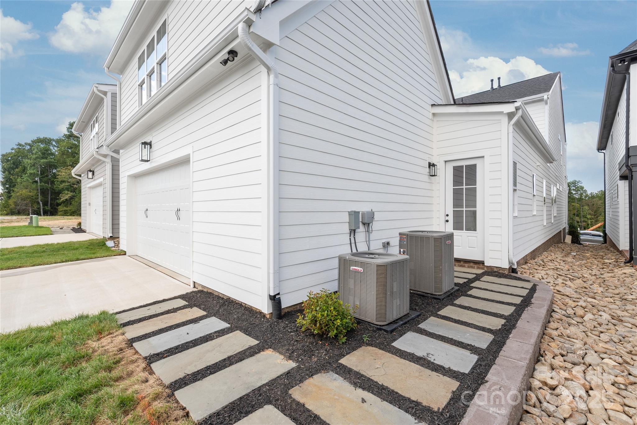 19028 Newburg Hill Road, Unit 22 Davidson, NC 28036 - Photo 43 of 44 a front view of a house with a yard