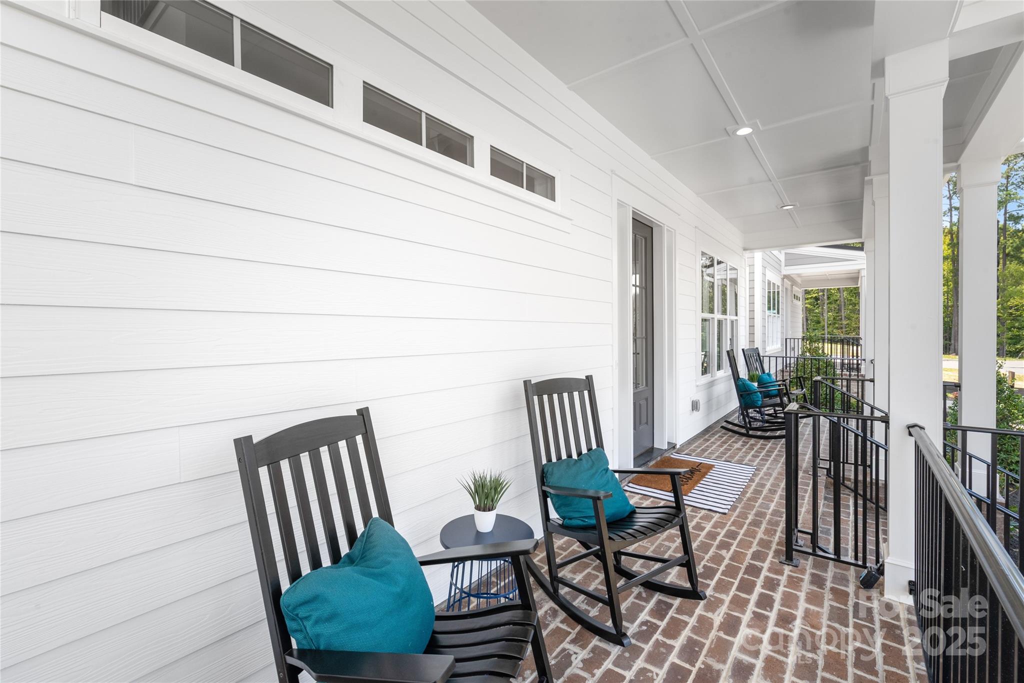 19028 Newburg Hill Road, Unit 22 Davidson, NC 28036 - Photo 5 of 44 a view of a chairs and table in the balcony