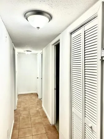 a view of a livingroom with a ceiling fan and window
