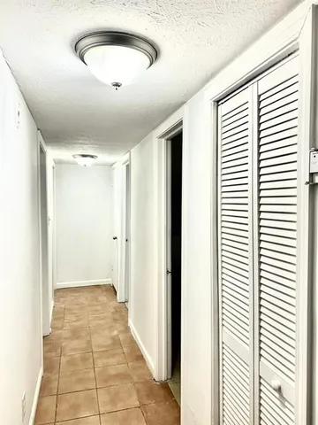 a view of a livingroom with a ceiling fan and window