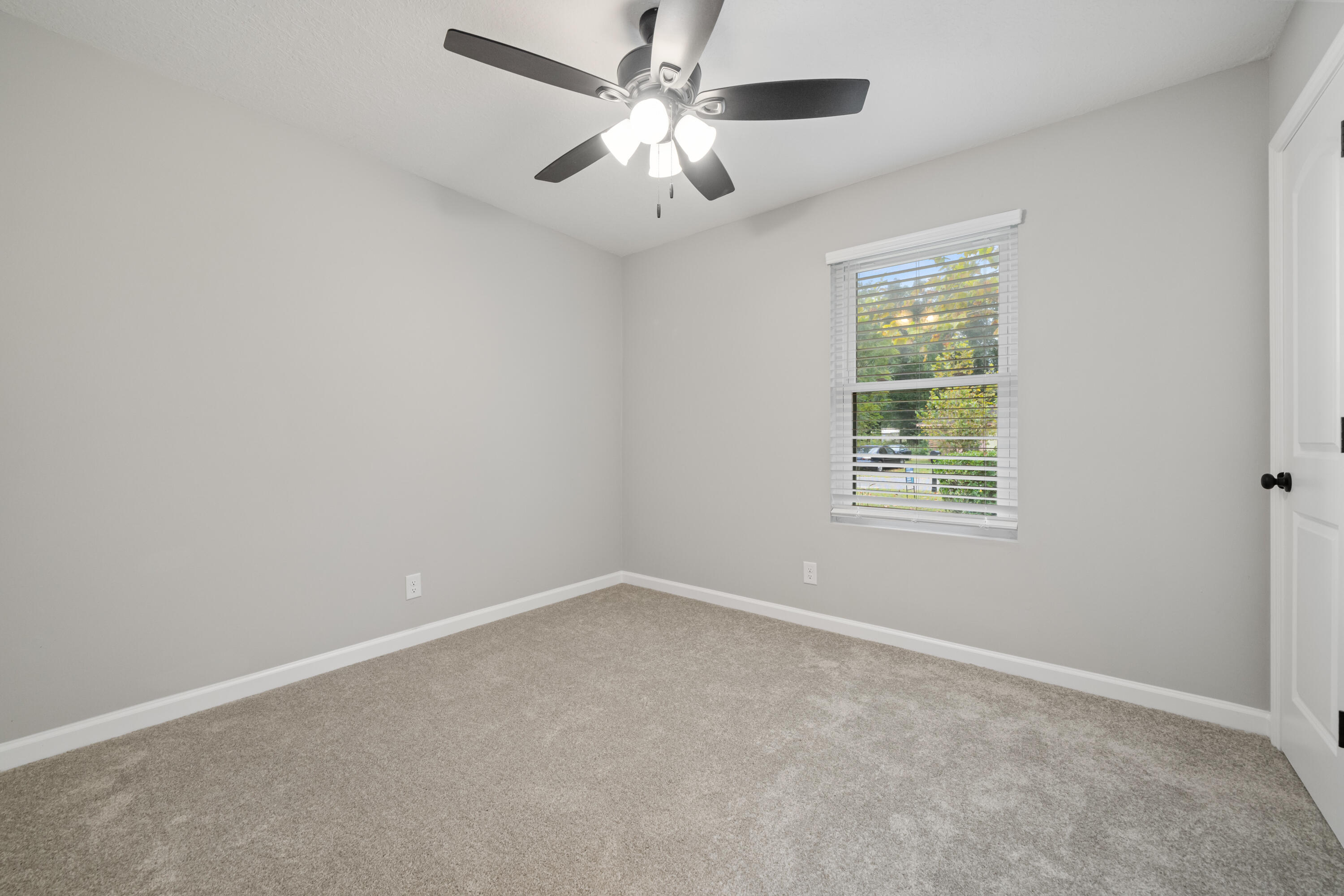 37 Beech Lane DeFuniak Springs, FL 32435 - Photo 15 of 26 an empty room with a window and a fan