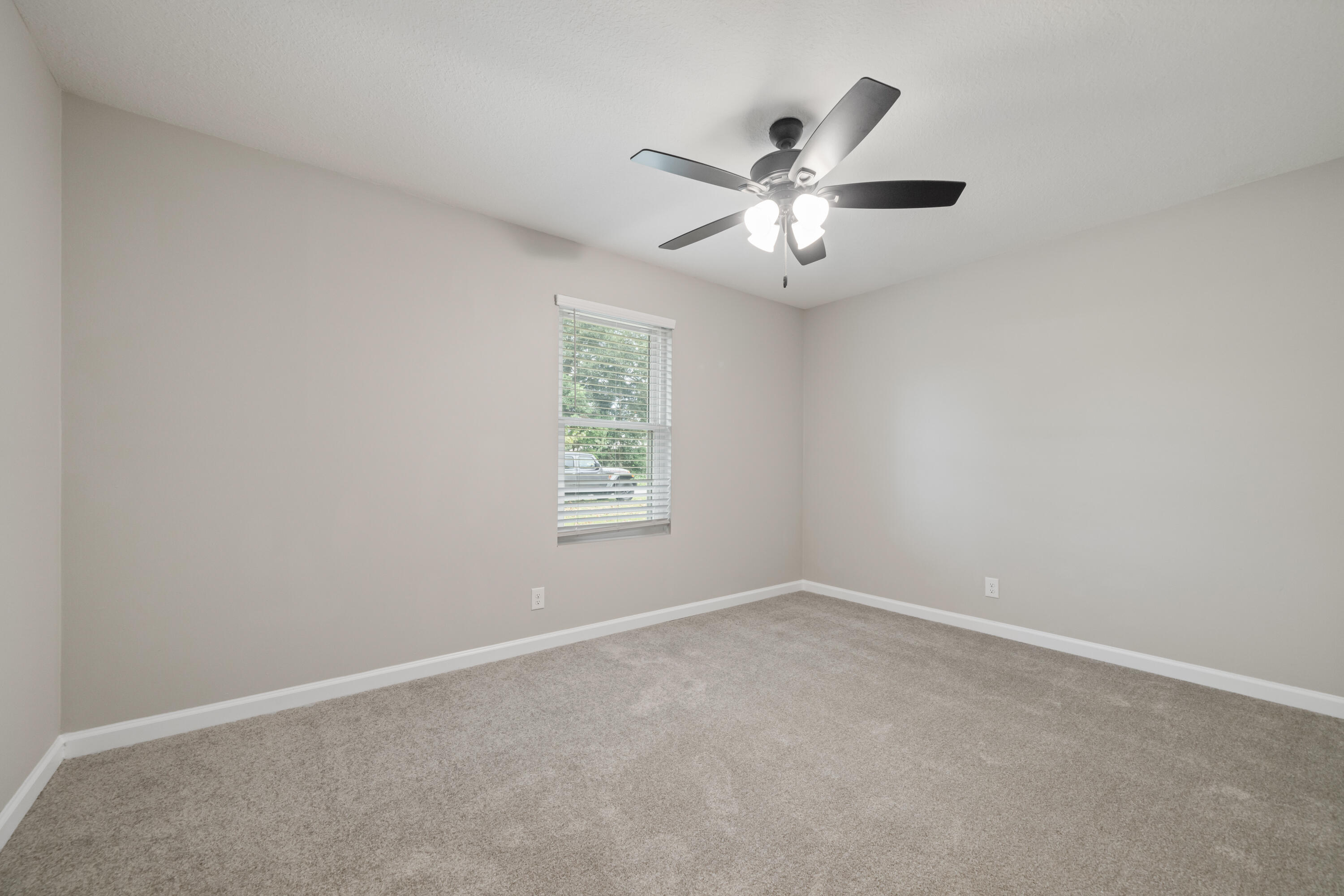 37 Beech Lane DeFuniak Springs, FL 32435 - Photo 17 of 26 an empty room with a window and a fan