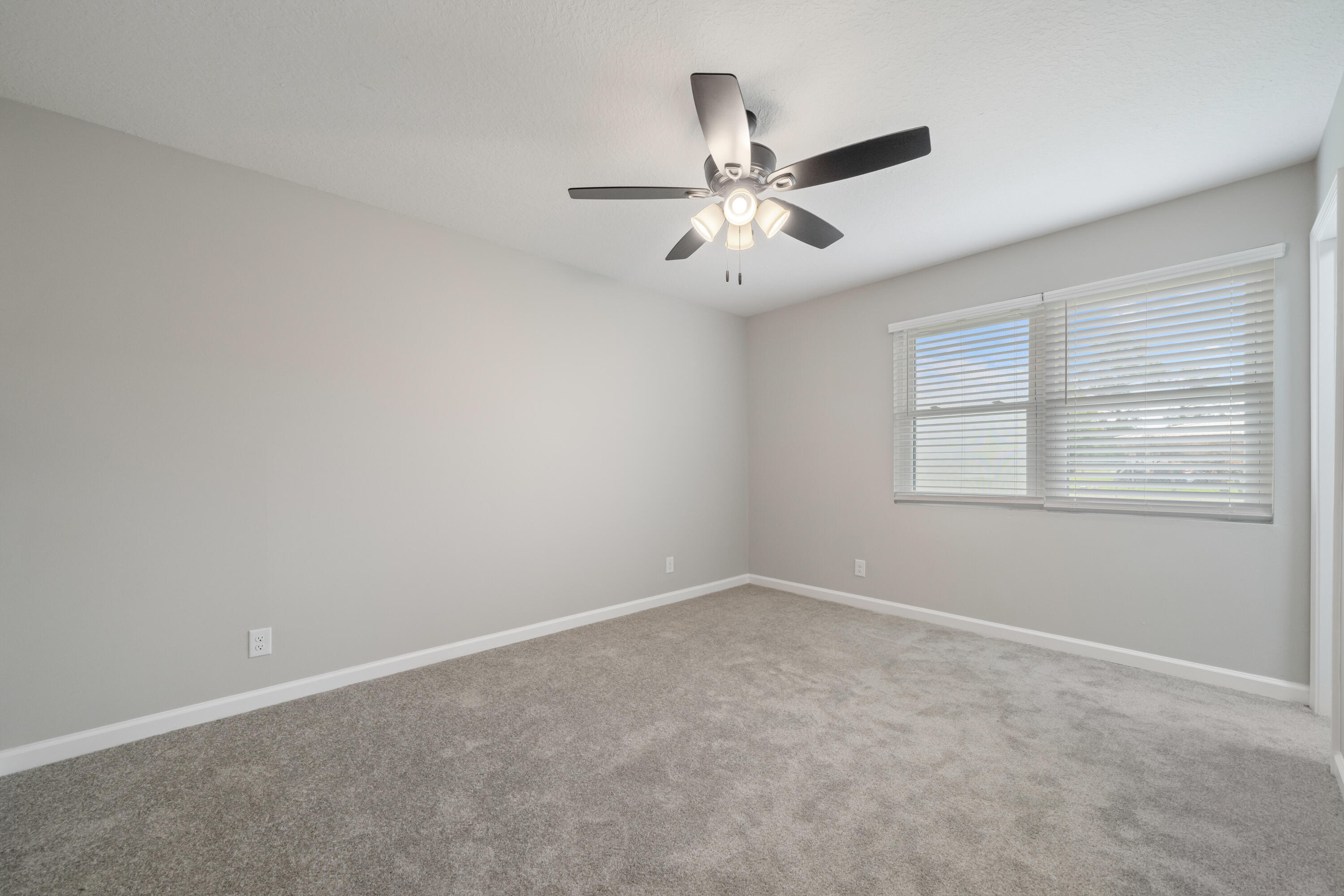 37 Beech Lane DeFuniak Springs, FL 32435 - Photo 19 of 26 an empty room with a window and a fan