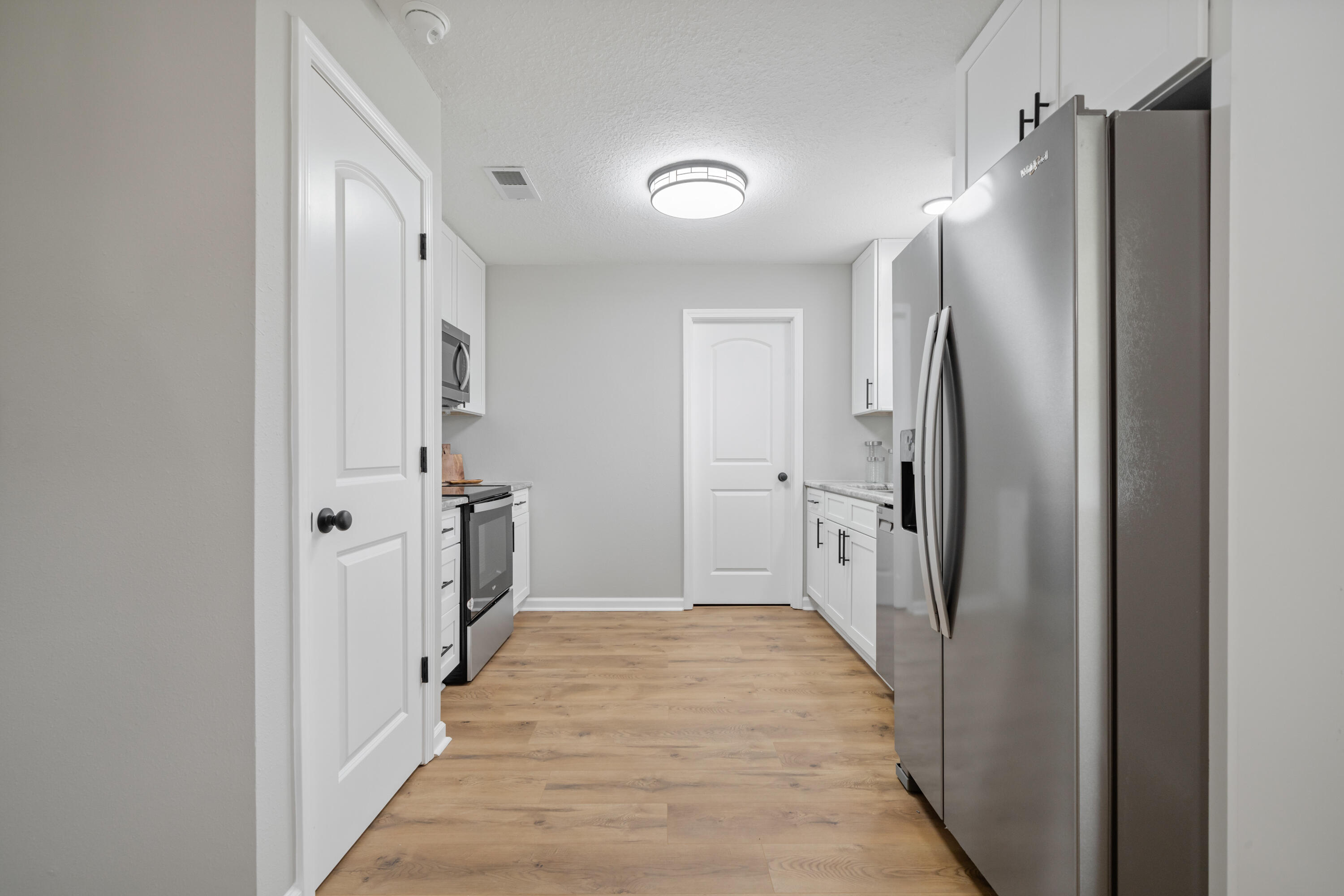 37 Beech Lane DeFuniak Springs, FL 32435 - Photo 2 of 26 a bathroom with a double vanity sink and a mirror