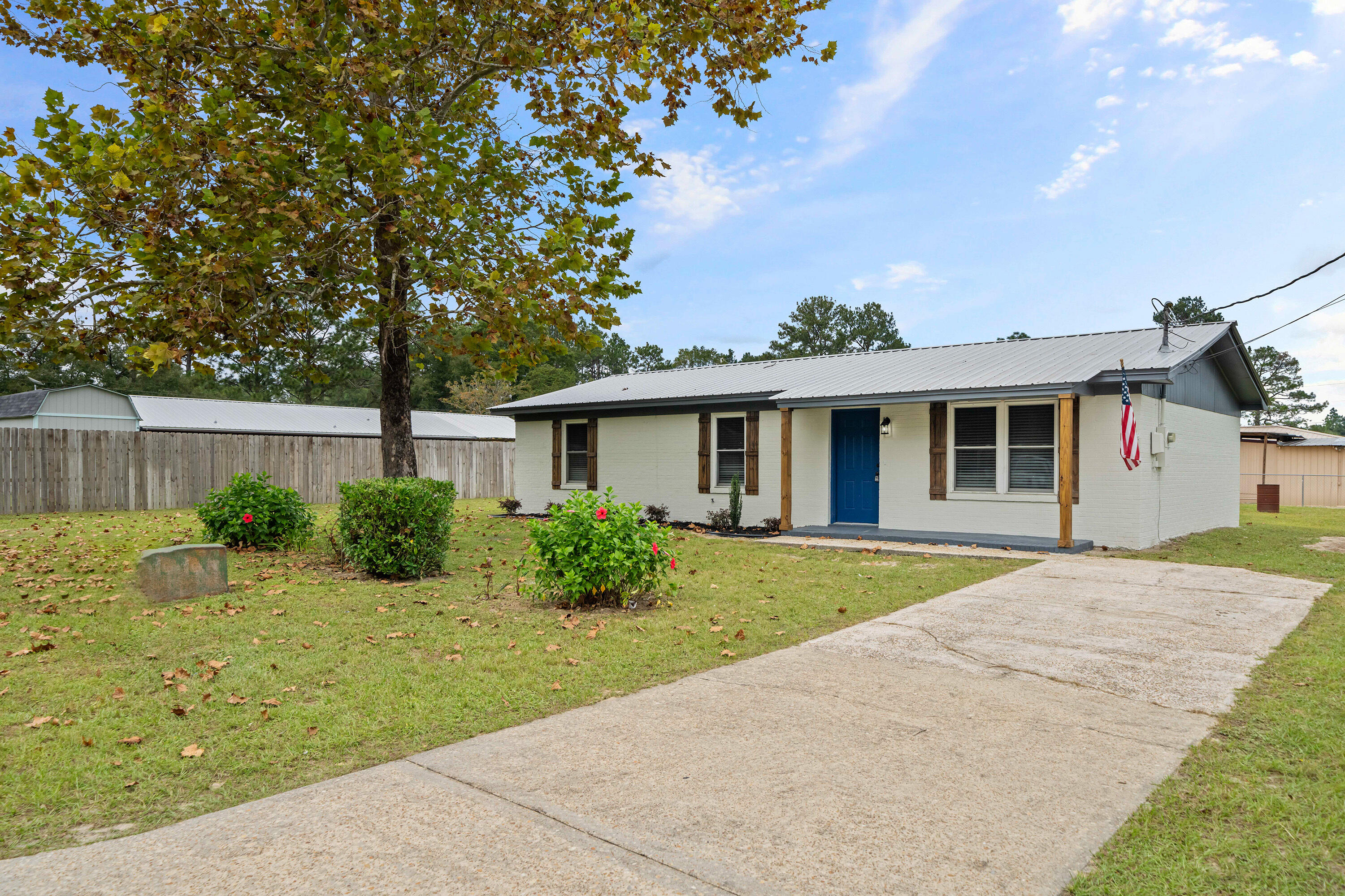37 Beech Lane DeFuniak Springs, FL 32435 - Photo 21 of 26 a front view of a house with a garden