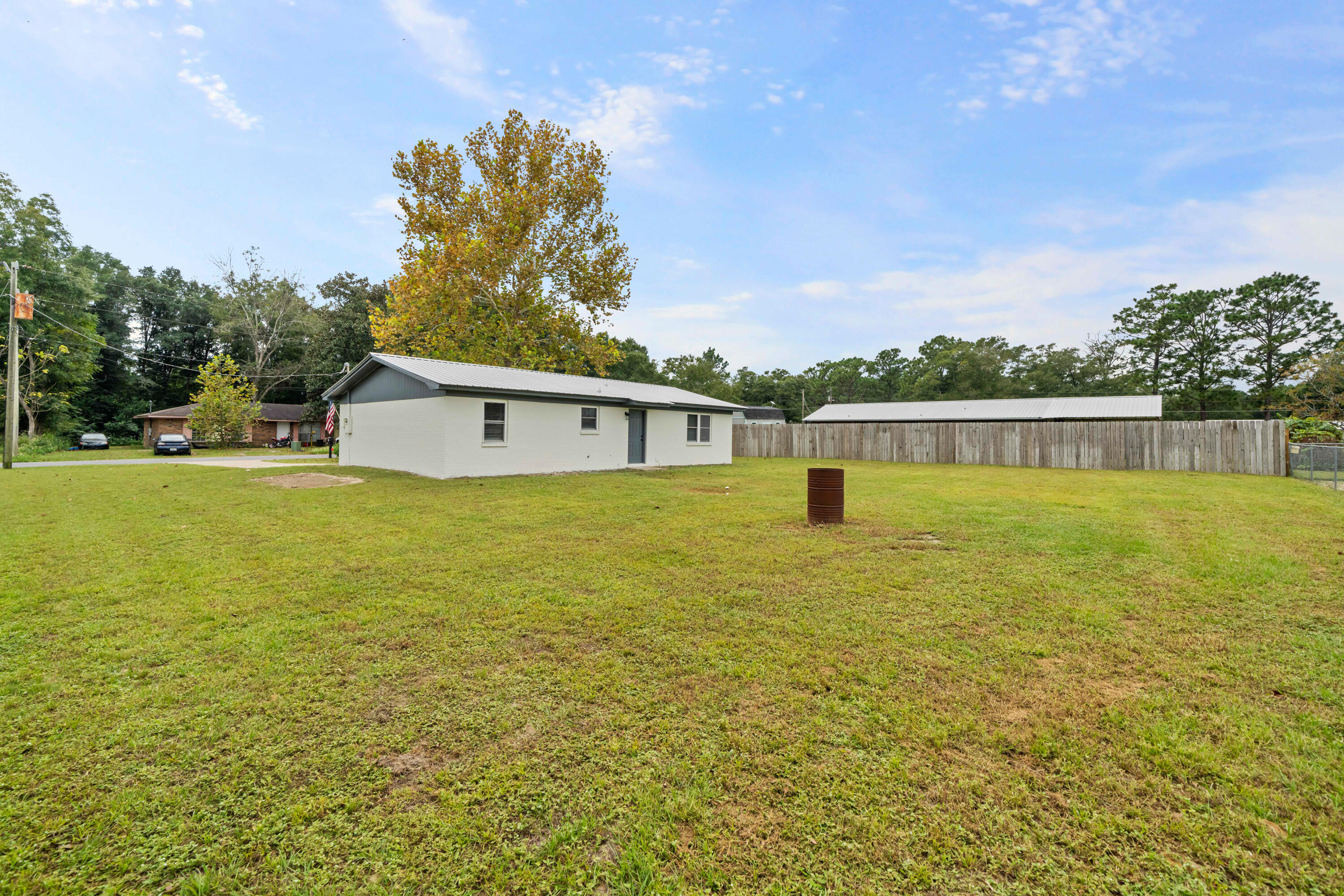 37 Beech Lane DeFuniak Springs, FL 32435 - Photo 22 of 26 a view of a lake with a big yard