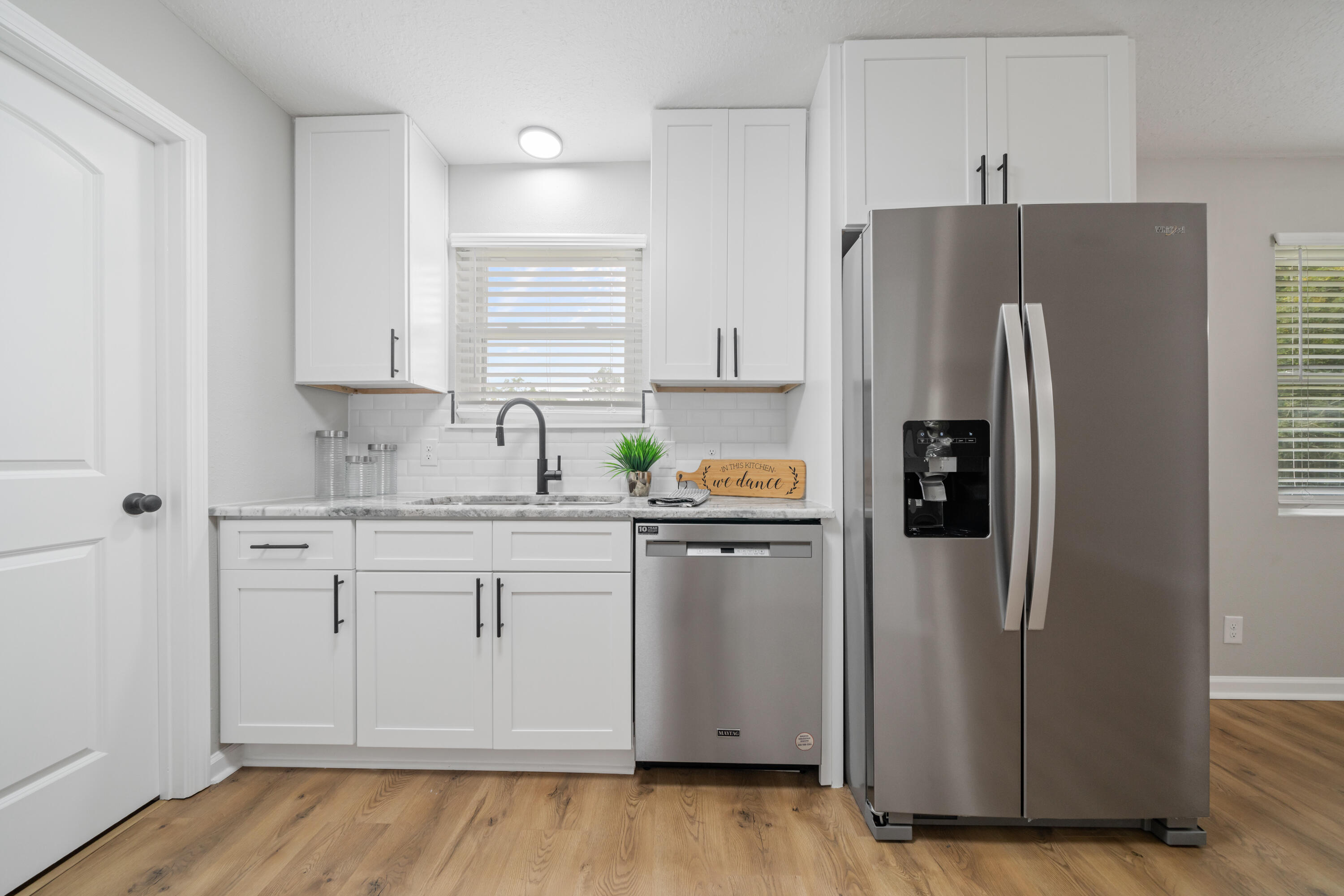 37 Beech Lane DeFuniak Springs, FL 32435 - Photo 4 of 26 a kitchen with stainless steel appliances a refrigerator sink and cabinets