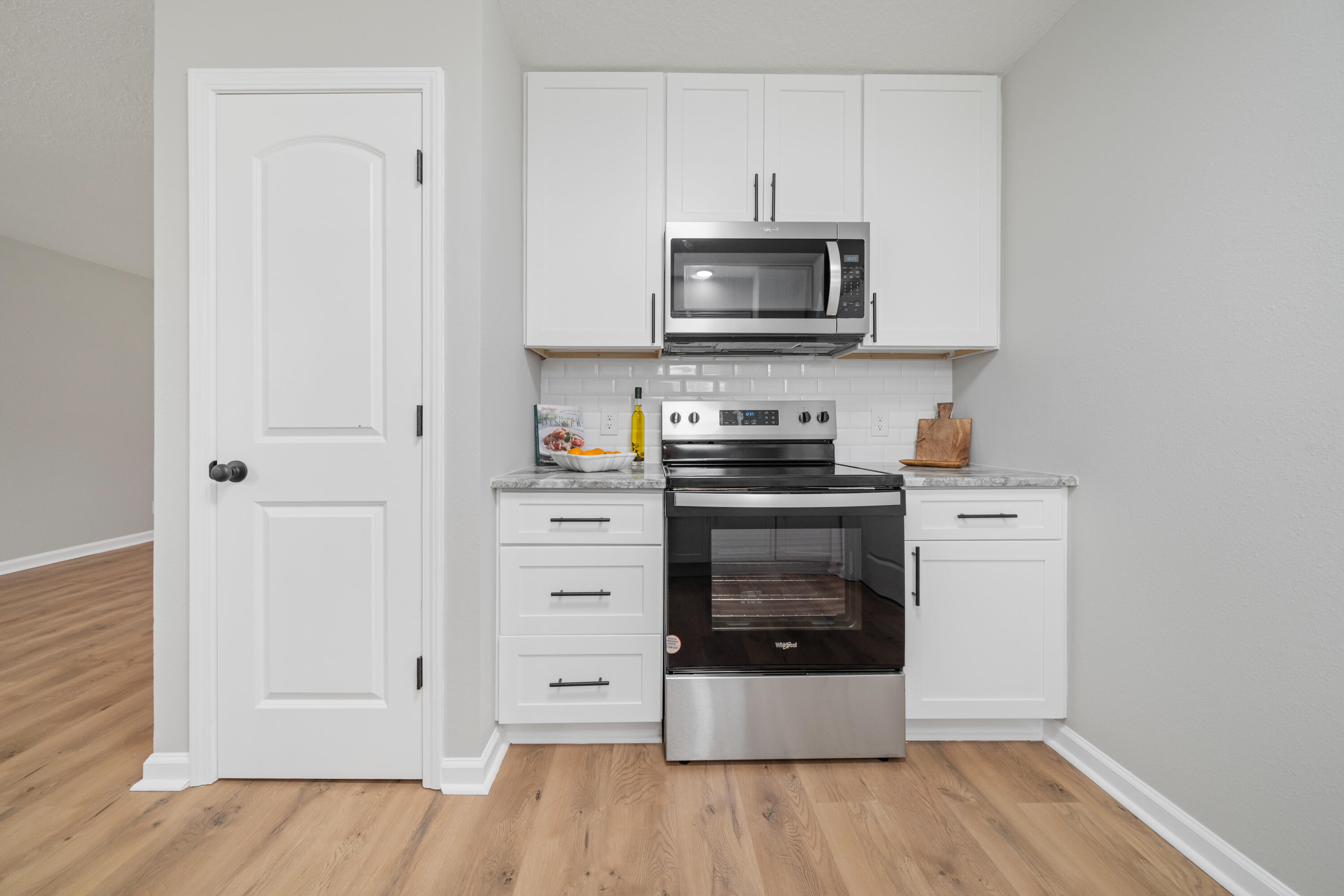 37 Beech Lane DeFuniak Springs, FL 32435 - Photo 5 of 26 a kitchen with stainless steel appliances a stove microwave and sink