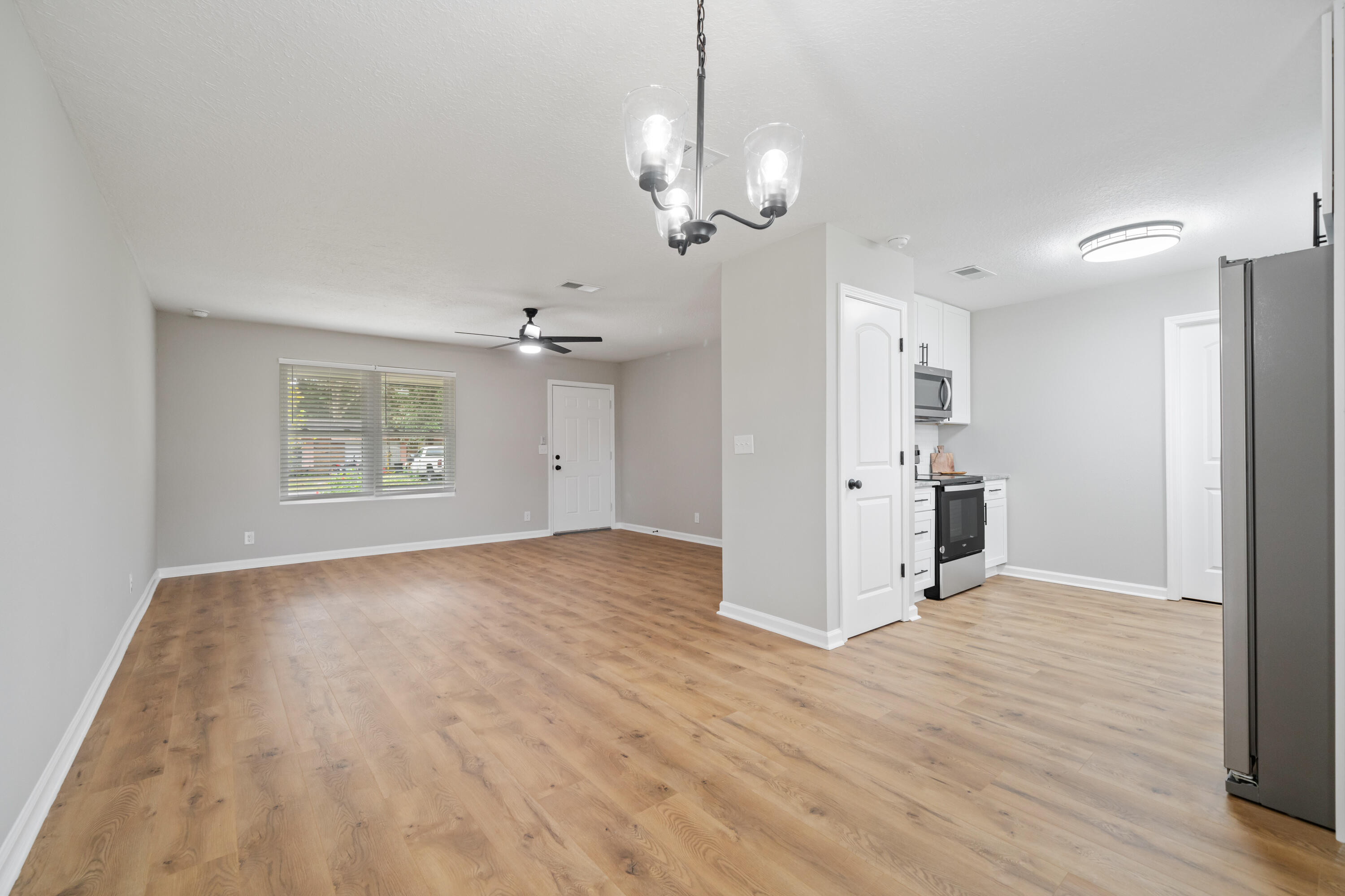 37 Beech Lane DeFuniak Springs, FL 32435 - Photo 6 of 26 a view of a livingroom with wooden floor