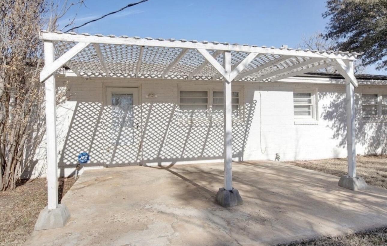 2319 53rd Street Lubbock, TX 79412 - Photo 17 of 20 a front view of a house with a yard