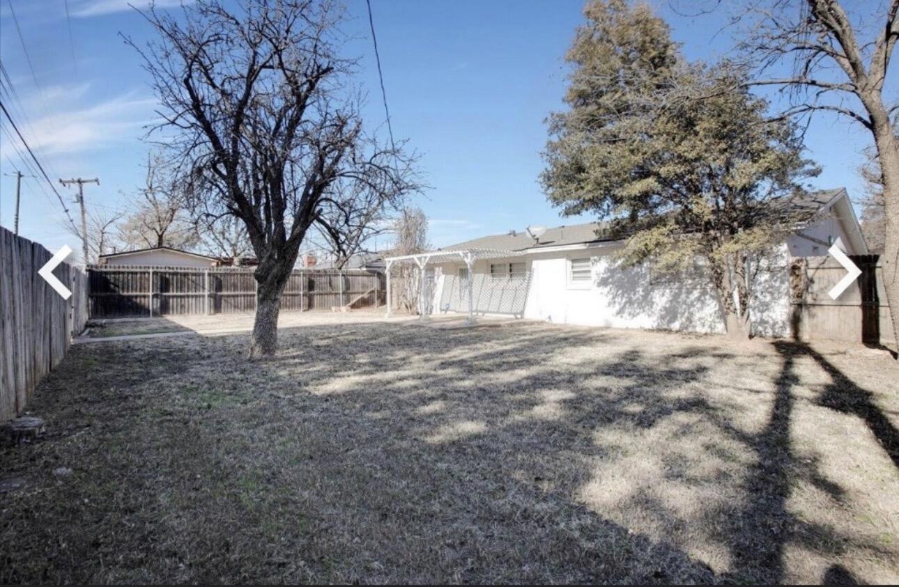 2319 53rd Street Lubbock, TX 79412 - Photo 20 of 20 a view of a yard with a tree