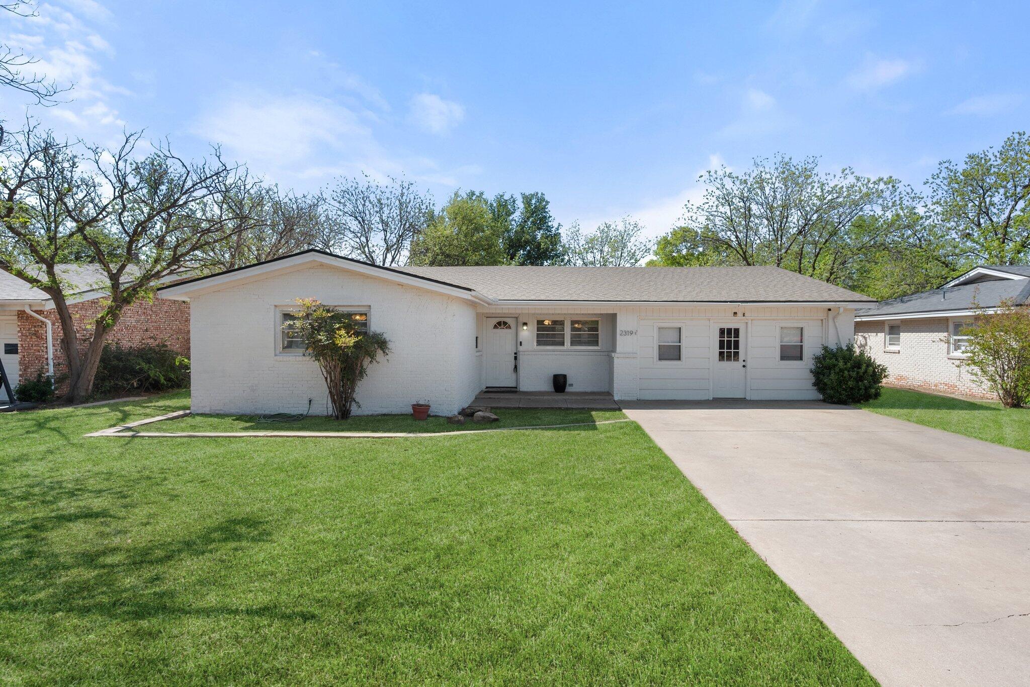 2319 53rd Street Lubbock, TX 79412 - Photo 2 of 20 a house view with a garden space
