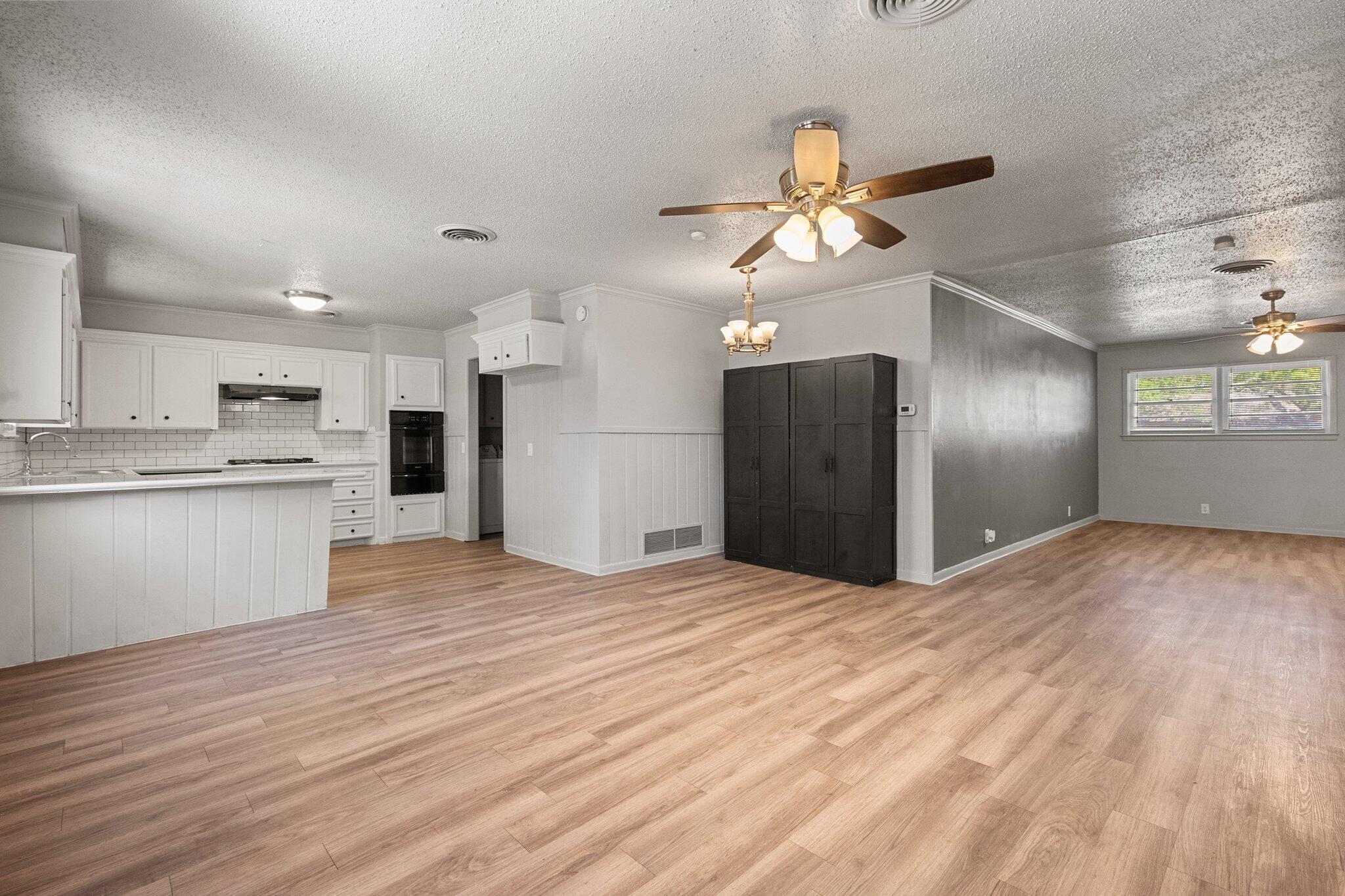 2319 53rd Street Lubbock, TX 79412 - Photo 4 of 20 a view of a kitchen with a sink and a kitchen view