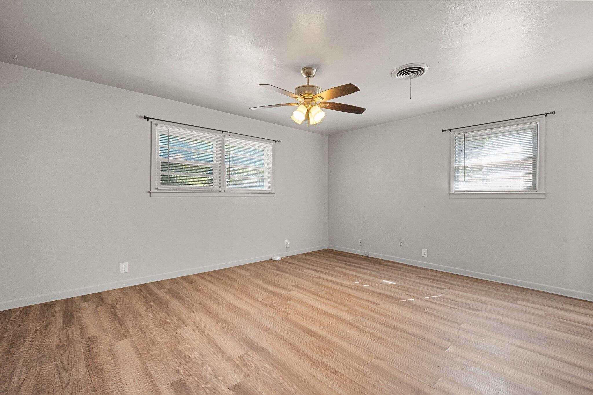 2319 53rd Street Lubbock, TX 79412 - Photo 9 of 20 a view of empty room with wooden floor