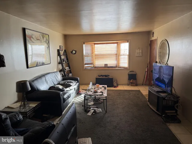 a work room with furniture and a window
