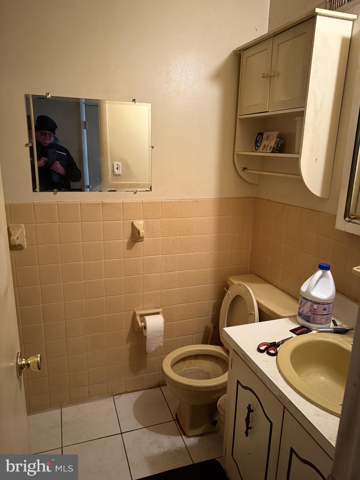 10218 Bustleton Avenue Philadelphia, PA 19116 - Photo 6 of 18 a bathroom with a toilet sink and mirror
