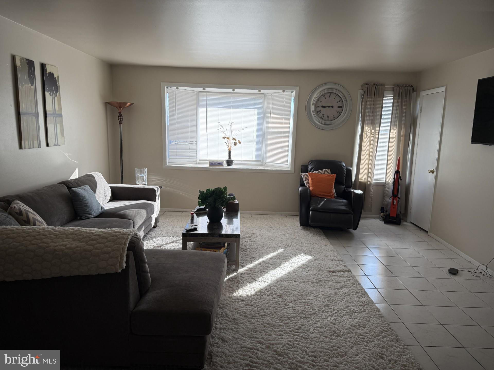 10218 Bustleton Avenue Philadelphia, PA 19116 - Photo 8 of 18 a living room with furniture and a large window