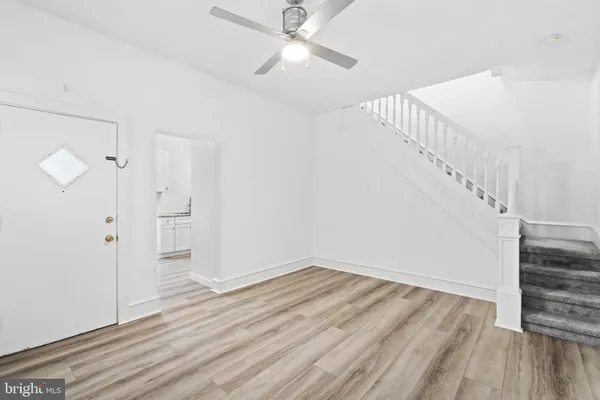 a view of entryway with wooden floor