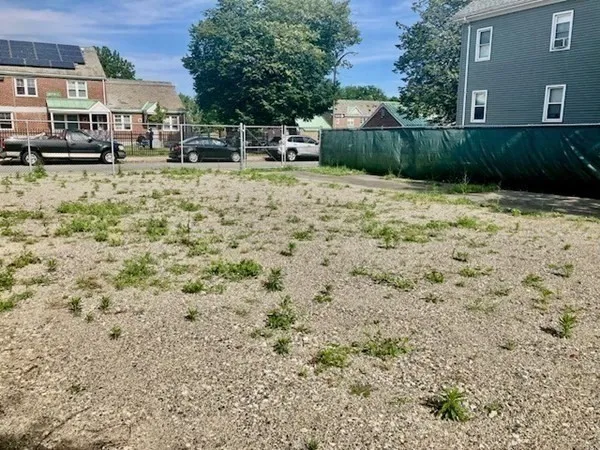 a view of backyard with seating space