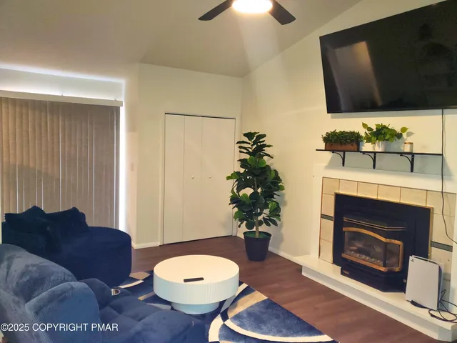 a living room with furniture and a fireplace