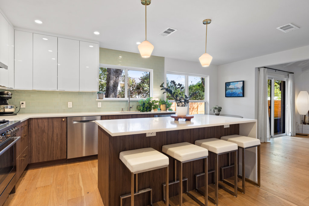 4618 Trail Crest Circle Austin, TX 78735 - Photo 21 of 40 a kitchen with a table and chairs in it