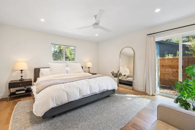 a view of a backyard with tree