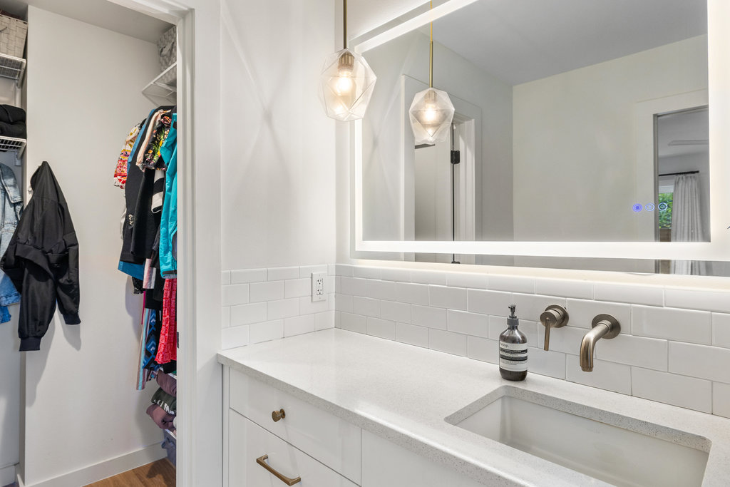 4618 Trail Crest Circle Austin, TX 78735 - Photo 29 of 40 a bathroom with a sink and a mirror