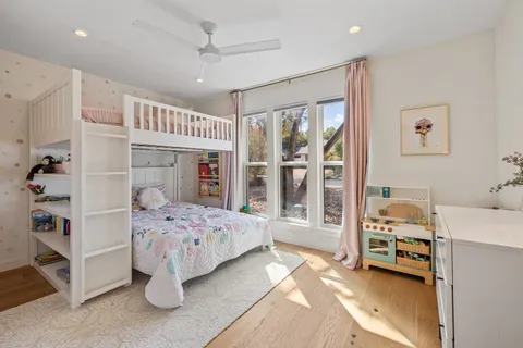 a bedroom with furniture and a window