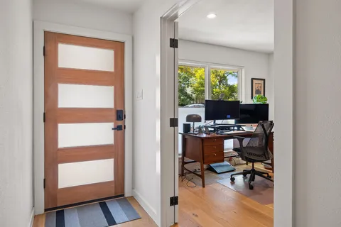 a workspace with furniture and window