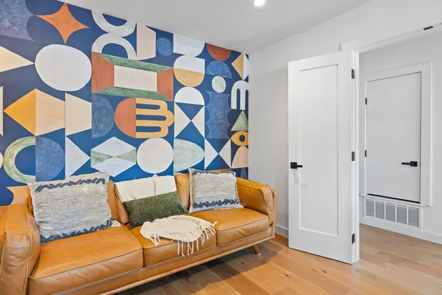 a living room with fireplace furniture and a flat screen tv