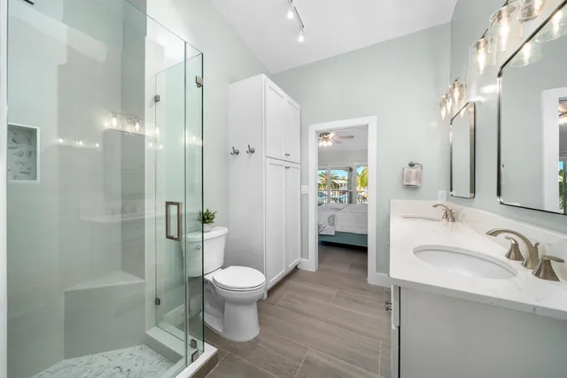 a bathroom with a sink toilet and shower