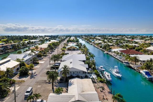 an aerial view of a city with ocean view