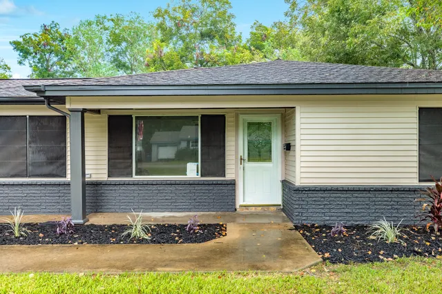 a view of a house with a small yard