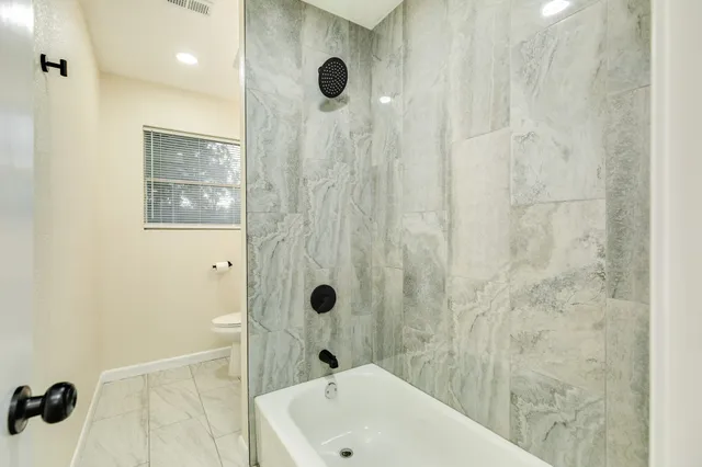 a bathroom with a sink and a shower