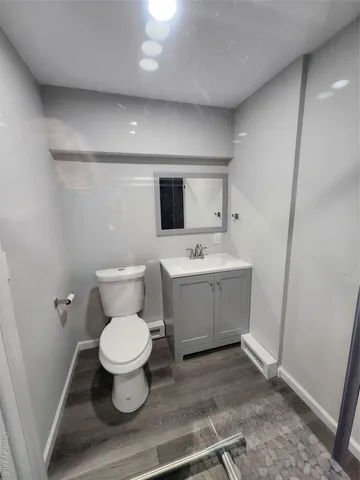 a bathroom with a glass shower door