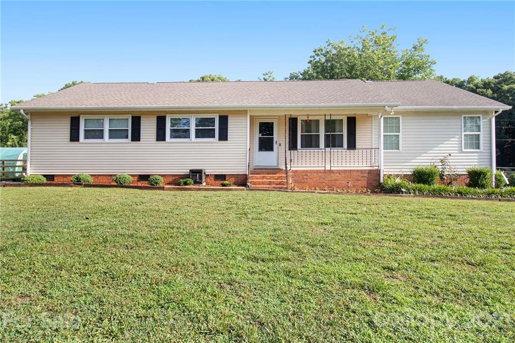 5702 Griffith Road Monroe, NC 28112 - Photo 1 of 35 a front view of a house with a yard