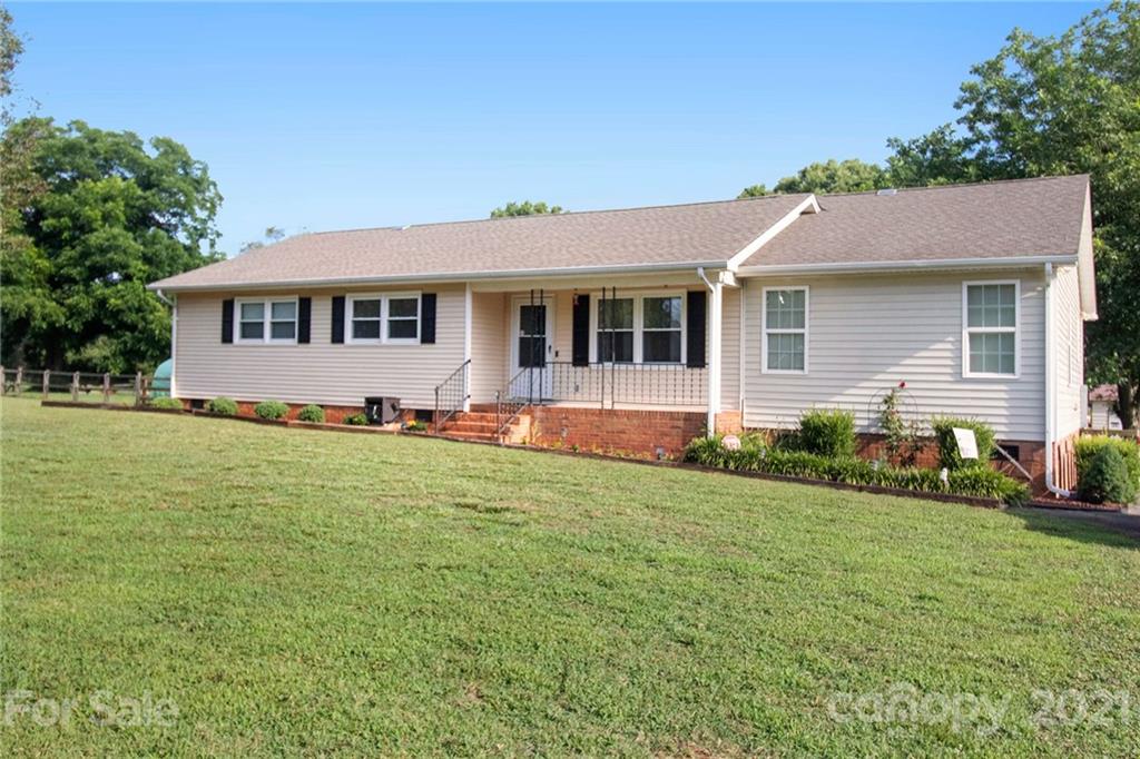 5702 Griffith Road Monroe, NC 28112 - Photo 2 of 35 a front view of a house with a yard