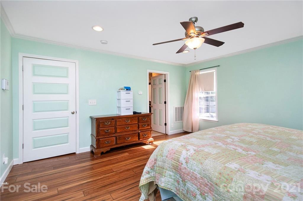 5702 Griffith Road Monroe, NC 28112 - Photo 15 of 35 a bedroom with a bed and a dresser