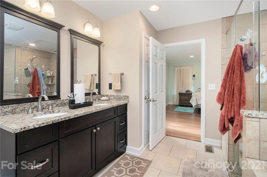 5702 Griffith Road Monroe, NC 28112 - Photo 18 of 35 a bathroom with a sink and a mirror