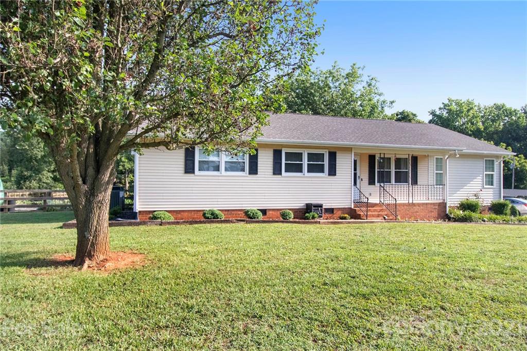 5702 Griffith Road Monroe, NC 28112 - Photo 3 of 35 a front view of a house with a yard