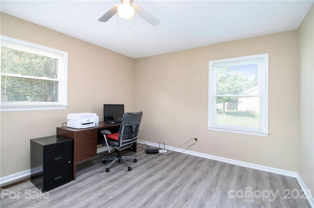5702 Griffith Road Monroe, NC 28112 - Photo 24 of 35 a view of workspace with wooden floor windows