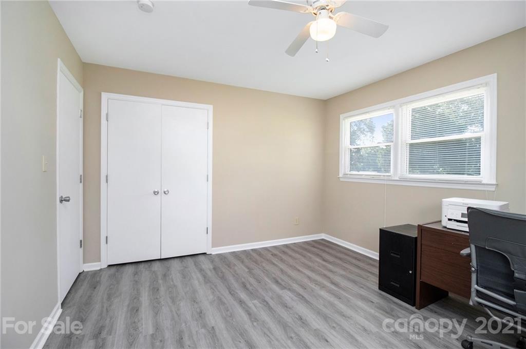 5702 Griffith Road Monroe, NC 28112 - Photo 25 of 35 a view of workspace with wooden floor and window