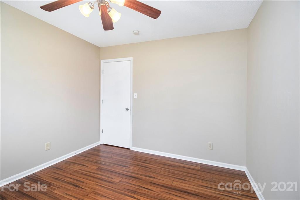 5702 Griffith Road Monroe, NC 28112 - Photo 27 of 35 a view of an empty room with wooden floor