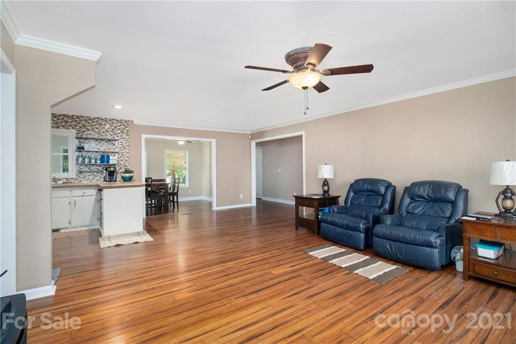 5702 Griffith Road Monroe, NC 28112 - Photo 4 of 35 a living room with furniture and a wooden floor