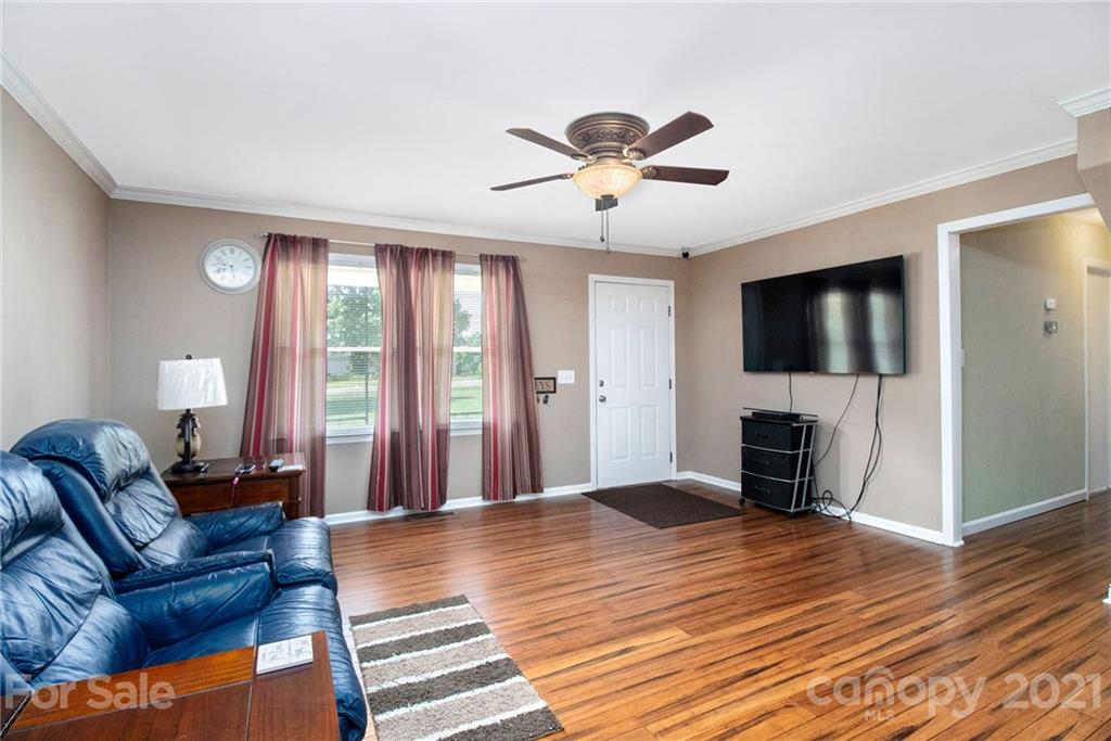 5702 Griffith Road Monroe, NC 28112 - Photo 5 of 35 a living room with furniture and a flat screen tv