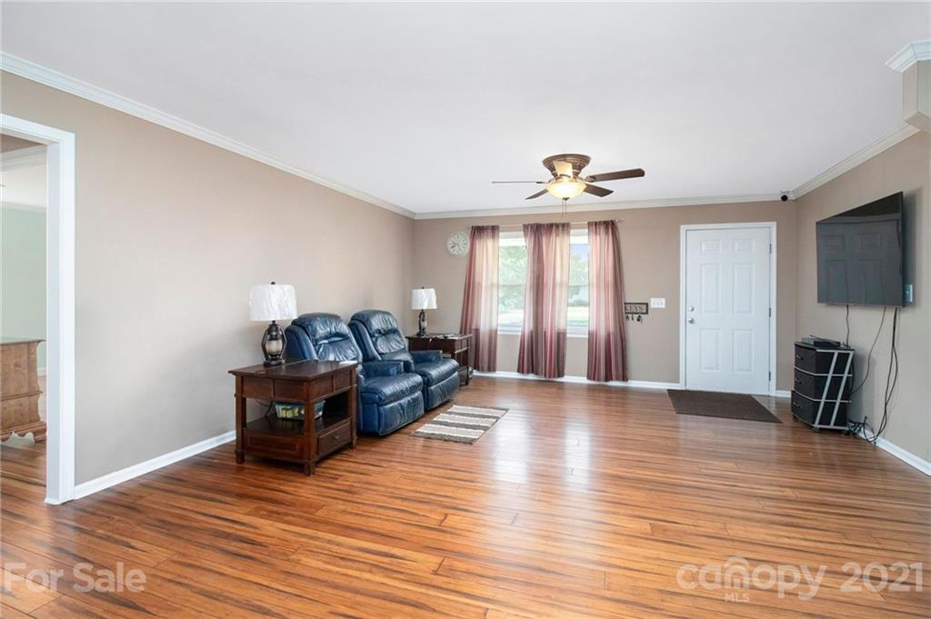 5702 Griffith Road Monroe, NC 28112 - Photo 6 of 35 a view of livingroom with furniture and wooden floor