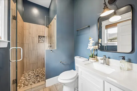 a kitchen with a sink and a refrigerator