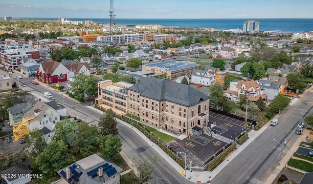 a kitchen with stainless steel appliances granite countertop a sink table and chairs